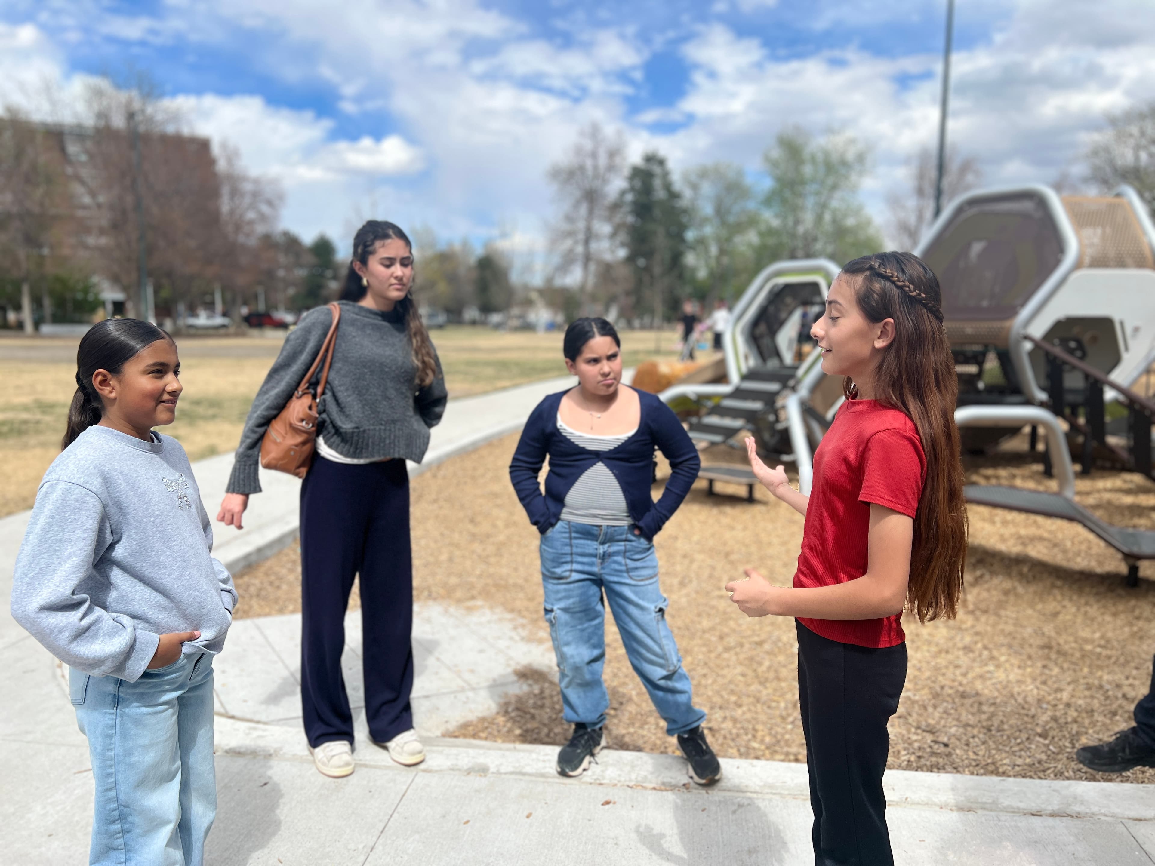 Group of young people smiling during an outdoor debate